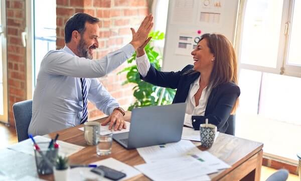High five between office mates